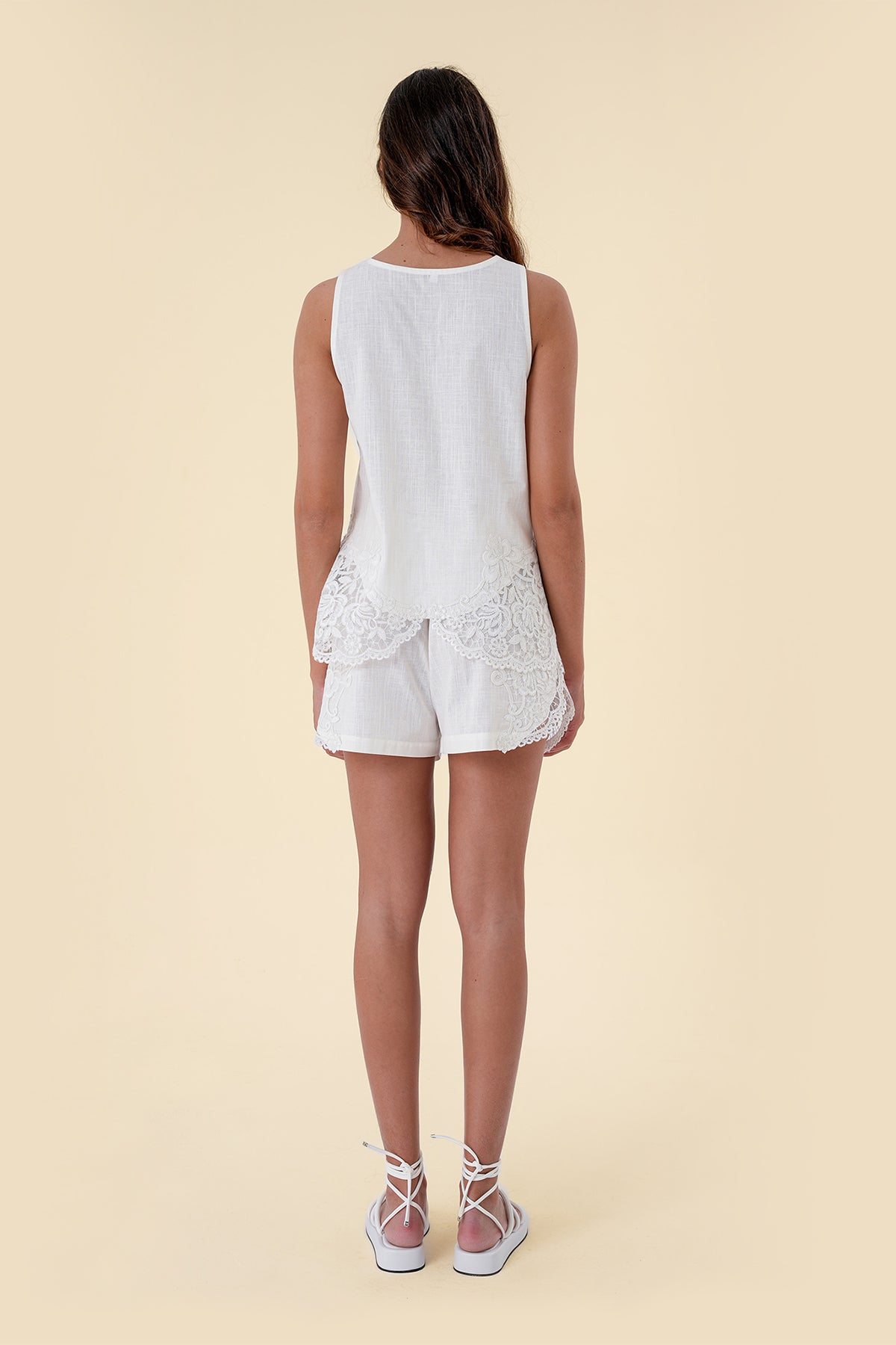 Two-Piece Set with Sleeveless Round-Neck Top Featuring Applique Accents and Matching Shorts