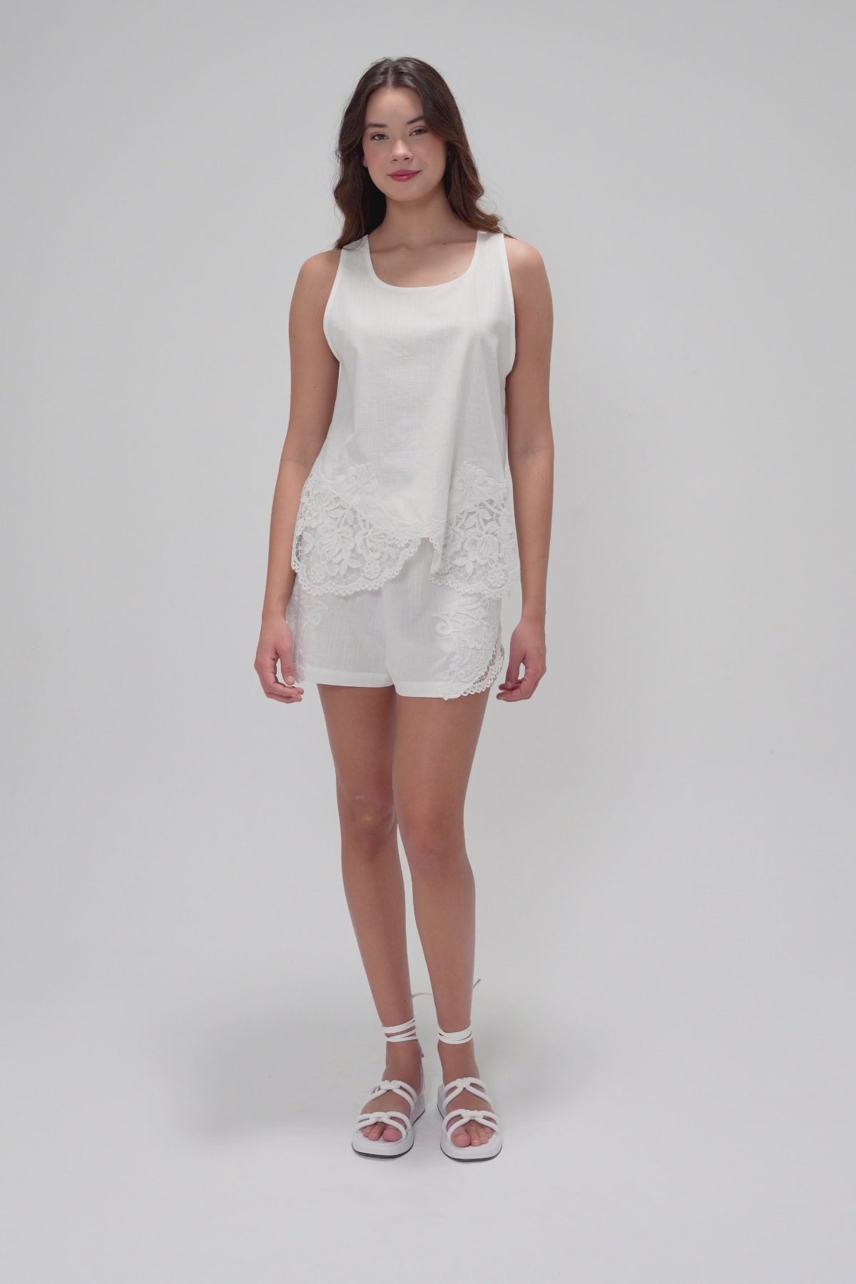 Two-Piece Set with Sleeveless Round-Neck Top Featuring Applique Accents and Matching Shorts